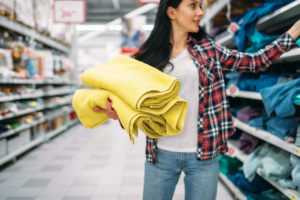 Woman buying towels in store